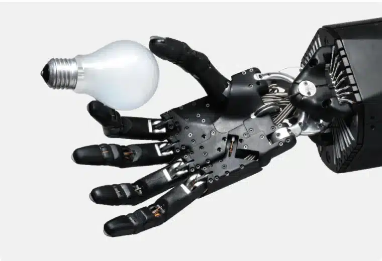 Our Story 6 Shadow Robot Dexterous Hand carefully holding a light bulb